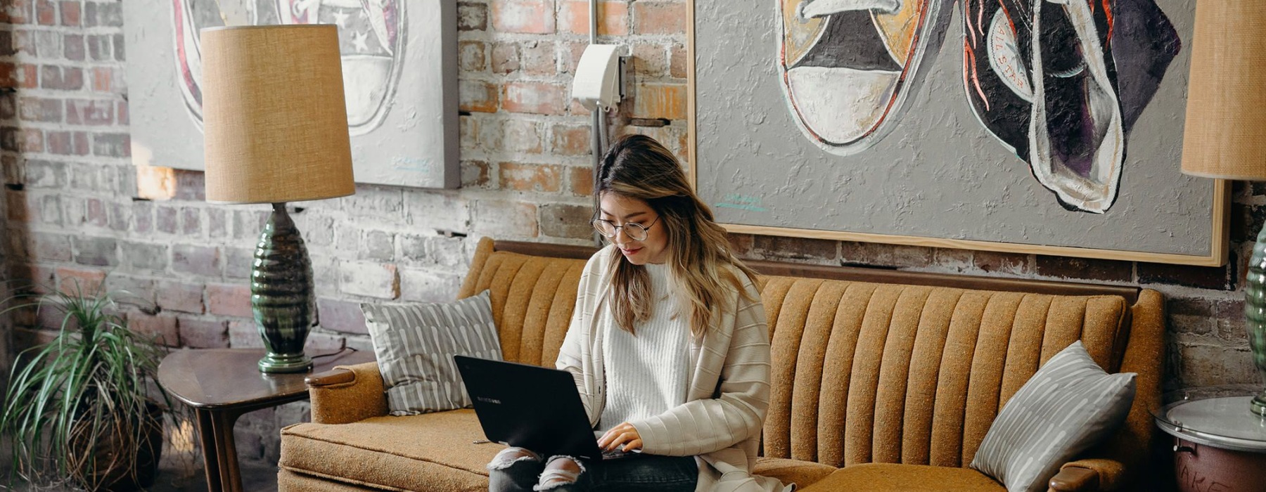 a woman typing on her laptop