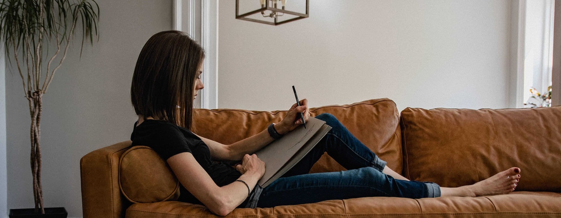 a woman relaxing on a sofa